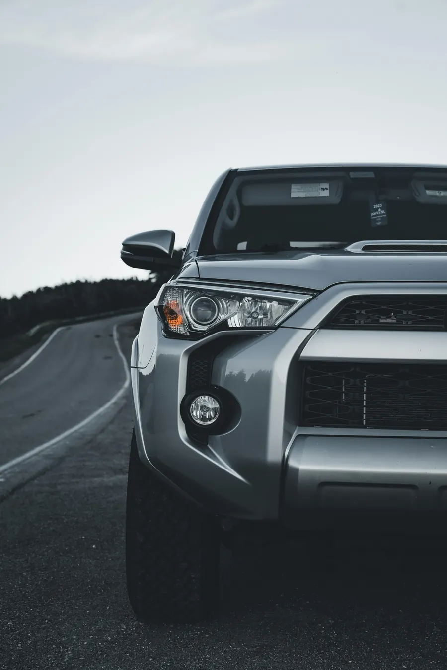 Gray Toyota 4Runner on a winding road